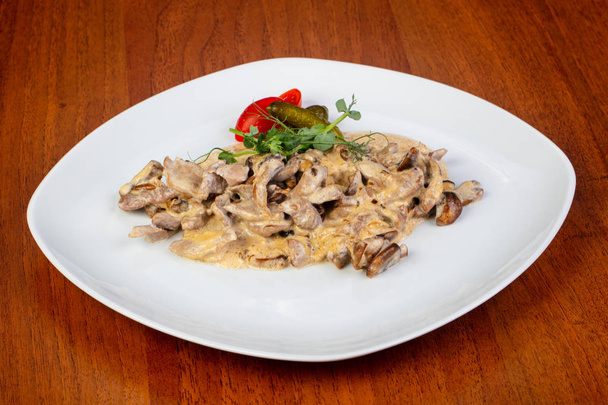 Delicious fried beef stroganoff with salad - Photo, Image