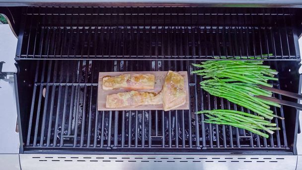 Step by step. Grilled salmon on plank in dijon mustard with asparagus. - Photo, Image
