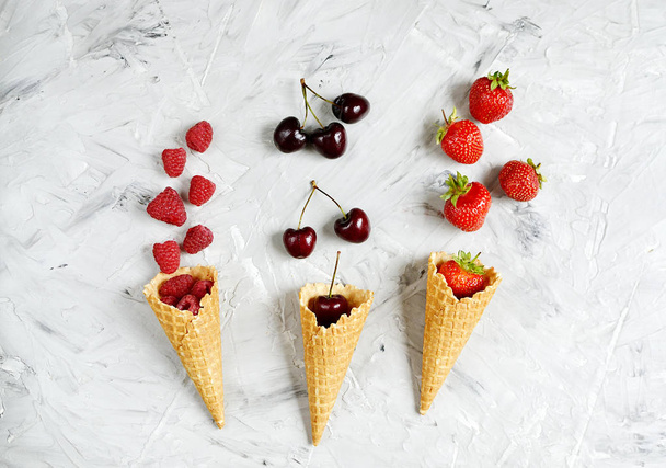 Various Berries in Waffle Cones Summer Tine Minimalism Style Gray Concrete Background - Fotografie, Obrázek