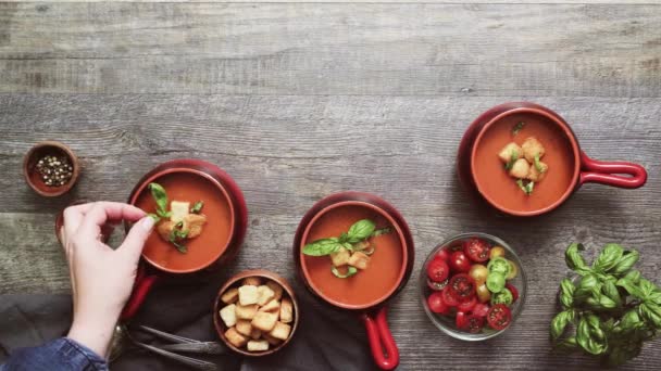 Roasted tomato soup with fresh basil and croutons. - Footage, Video