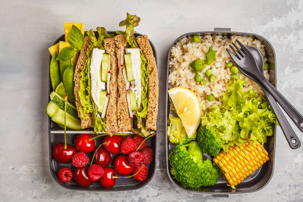 Healthy meal prep containers with feta sandwich with fruits, berries, rice and vegetables. Healthy vegetarian food concept. Takeaway food. - Foto, Imagem