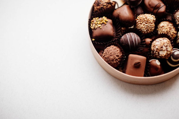 Box of chocolate candy. - Фото, изображение