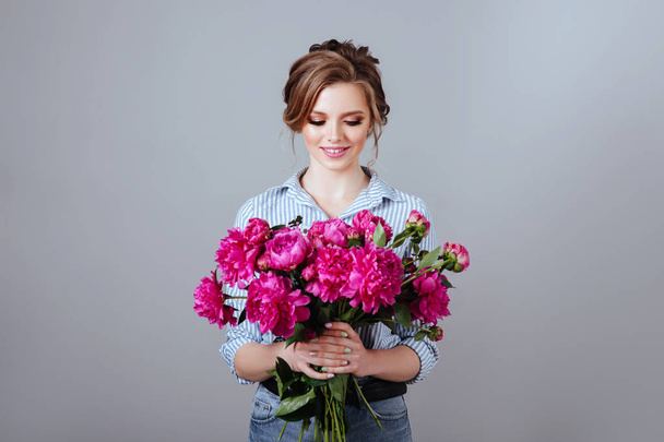 Fashion beautiful model with flowers , spring look. - Zdjęcie, obraz