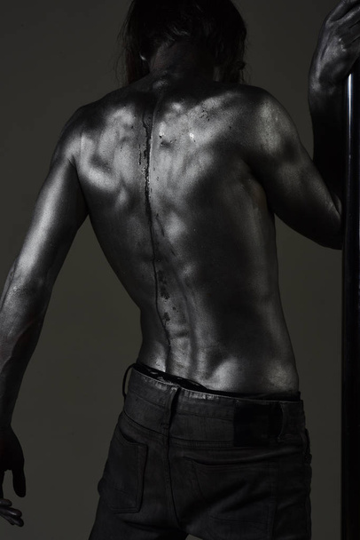 back treatment of muscular man at pole. back health and power - Фото, зображення