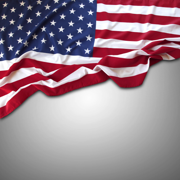 Closeup of American flag on grey background - Photo, Image