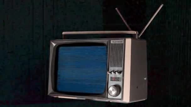 recorte retro televisión girando en el espacio con distorsión en la pantalla
 - Metraje, vídeo