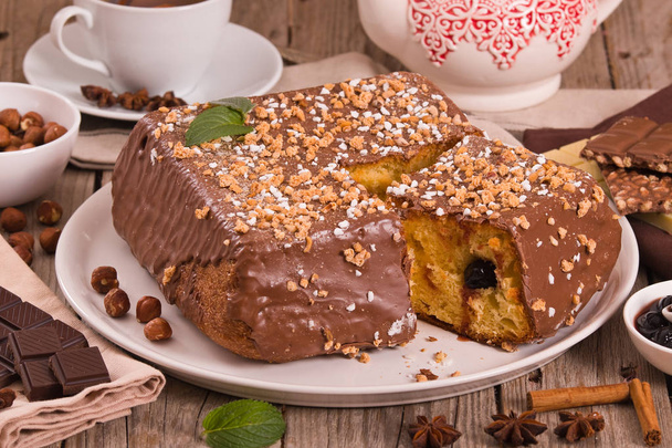 Chocolate hazelnut cake on white dish. - Photo, image