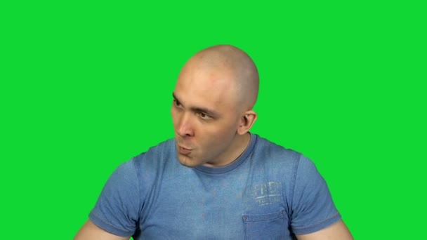 Lie and bald man on green background - Footage, Video