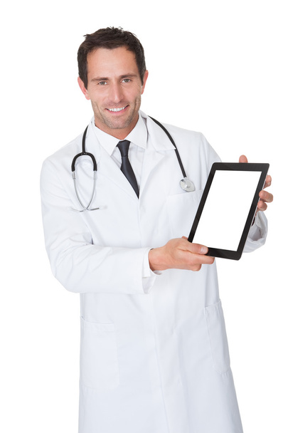Doctor presenting empty digital tablet - Foto, imagen