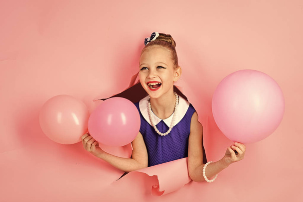 Happy girl. Birthday, happiness, childhood, look. Small girl child with party balloons, celebration. Little girl with hairstyle hold balloons. Kid with balloons at birthday. Beauty and fashion, punchy - Φωτογραφία, εικόνα