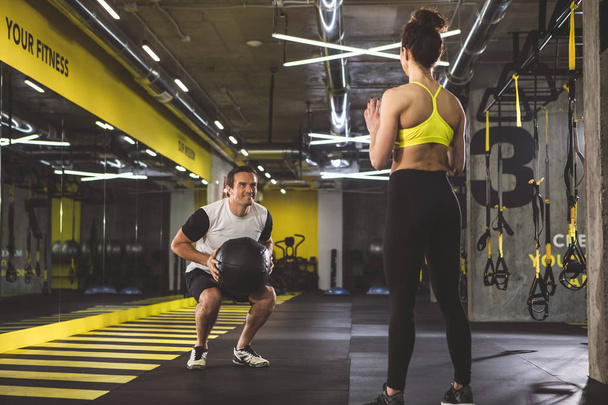 Positive man and girl working out - Foto, afbeelding