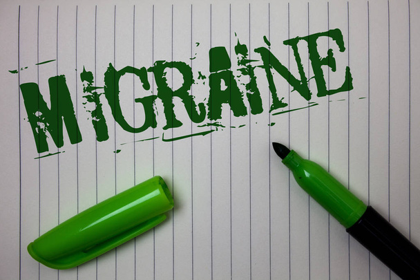Handwriting text Migraine. Concept meaning Recurrent headache in one side of head nausea and disturbed vision Linned paper background pen cap marker highlighter ink green drawing - Photo, Image