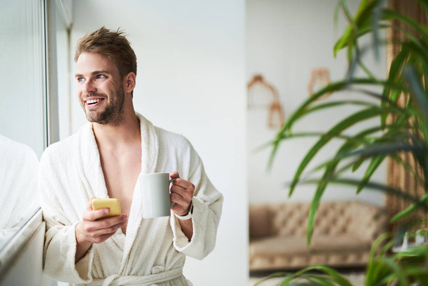 Happy guy enjoying morning in hotel - Fotografie, Obrázek