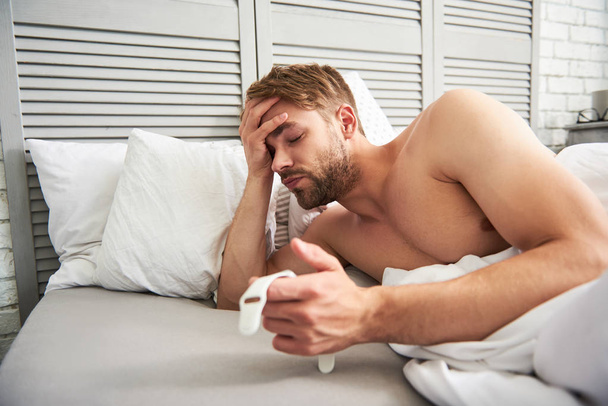 Exhausted man waking up at home - Fotoğraf, Görsel