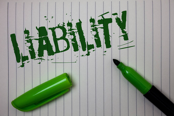 Handwriting text Liability. Concept meaning State of being legally responsible for something Responsibility Linned paper background pen cap marker highlighter ink green drawing - Photo, Image