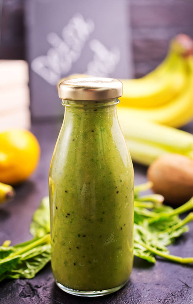 green smoothie in bottle and ingredients , healthy diet  - Foto, Bild