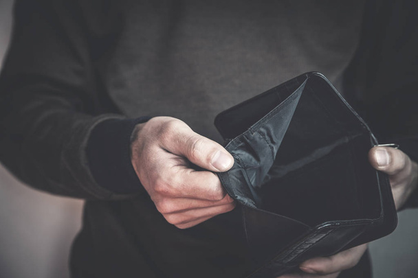 Caucasian man showing empty wallet. No money - Photo, Image