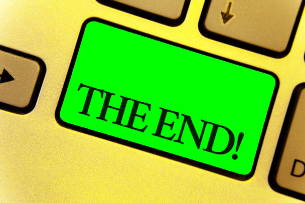 Text sign showing The End Motivational Call. Conceptual photo Conclusion of time for something ending of life Close up Keyboard key yellow laptop notebook creative computer key shadow - Photo, Image