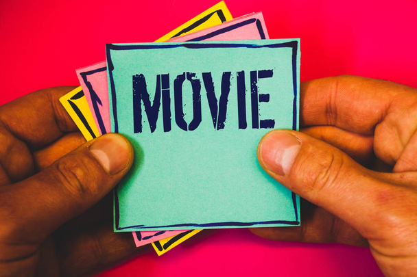 Writing note showing Movie. Business photo showcasing Cinema or television film Motion picture Video displayed on screen Small multi colour notes hand border plane background remember card - Φωτογραφία, εικόνα