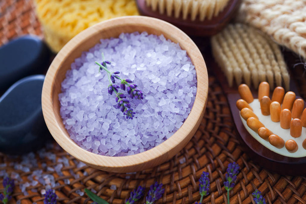 bowl with lavender salt and bath accessories, beauty treatment concept   - Photo, Image