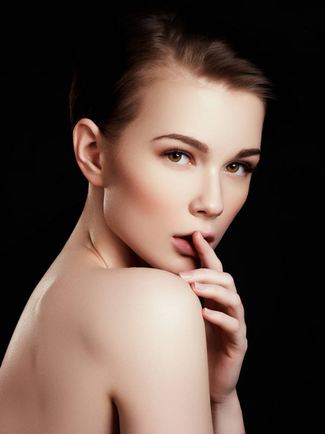 Beauty, spa. Attractive woman with beautiful face. Beautiful girl with daily makeup, youth and skin care concept. Woman beauty face portrait isolated on black with healthy skin. Face with perfect skin - Photo, Image