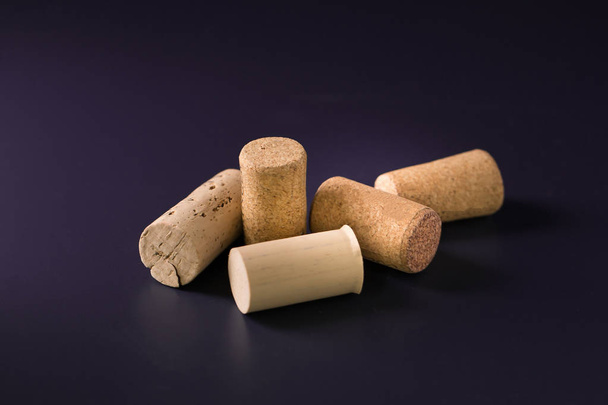 Pile of wine corks on black background - Foto, imagen