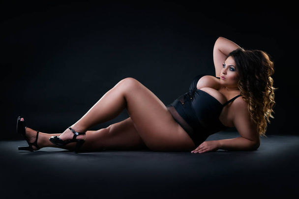 Plus size sexy model in swimsuit, fat woman on black studio background, overweight female body, full length portrait - Fotografie, Obrázek