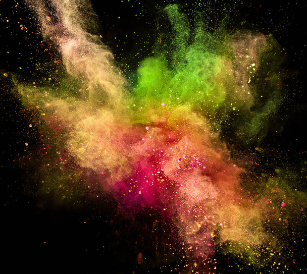 Colored powder explosion isolated on black background. - Фото, изображение