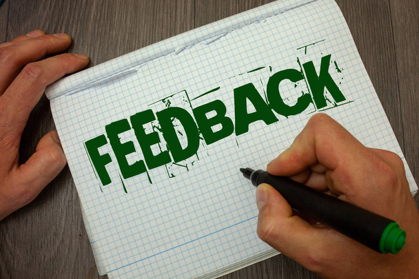 Conceptual hand writing showing Feedback. Business photo text Customer Review Opinion Reaction Evaluation Give a response back Man hold holding black marker gruge notebook wooden wood table - Photo, Image