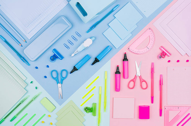 Blue, pink, mint color office stationery collection on soft pastel multicolor paper  background, top view. - 写真・画像
