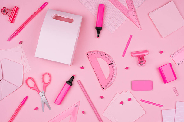 Pink office stationery collection on soft pastel pink paper background, top view. - Фото, зображення