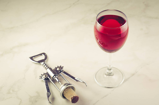 Food background with Wine and corkscrew/Food background with two red Wine and corkscrew.  - Fotó, kép