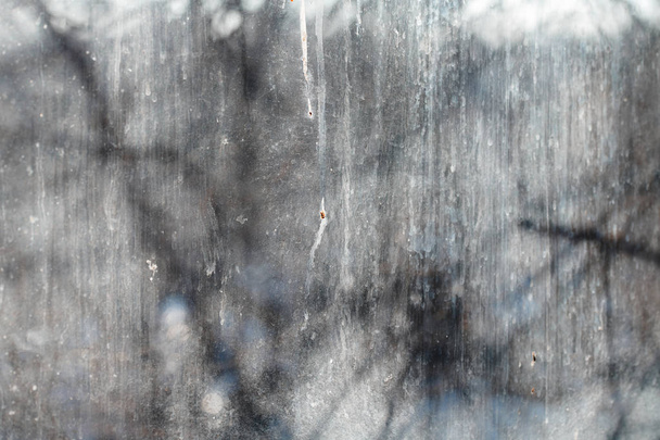 Textured background of the dirty window glass. Close-up - 写真・画像