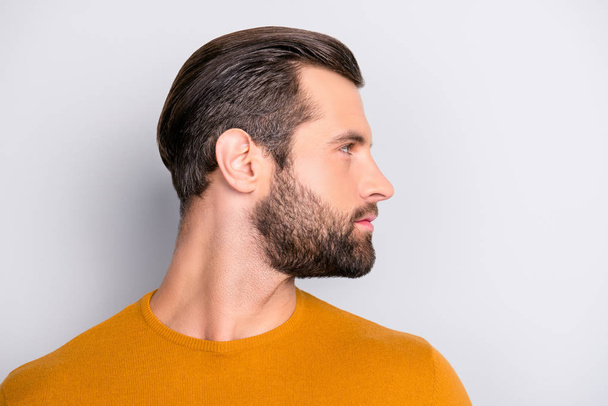 Close up profile side half-faced view portrait of handsome virile masculine brutal with trendy hairdress entrepreneur wearing color of mustard autumn sweater  isolated on gray background copyspace - Fotoğraf, Görsel