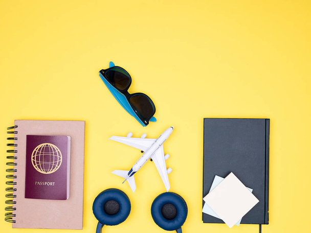 flat lay of traveler kit on yellow background - Foto, imagen