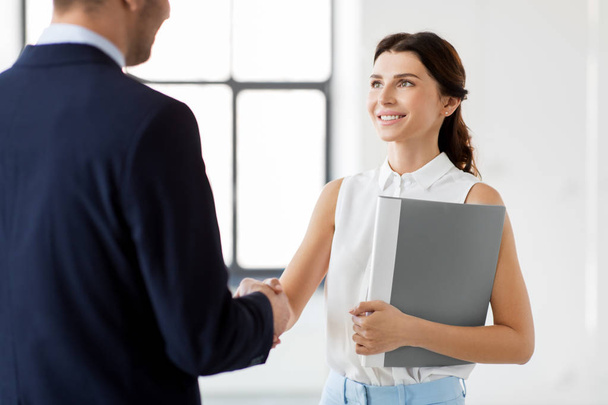businesswoman and businessman shake hands - Photo, image
