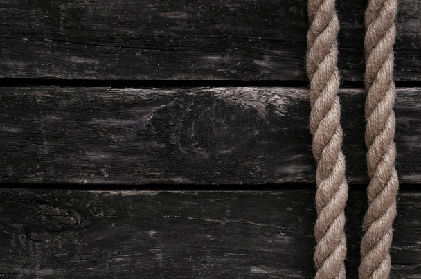 Moorings rope border frame on old wooden table background with copy space. - Photo, Image