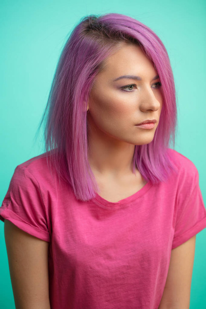 Colored hairs. Portrait of pretty serene woman with hairs dyed in pink or crimson color. Stylish haicut . Healthy Hair, Coloring Hair, Woman Beauty Concept - Photo, Image