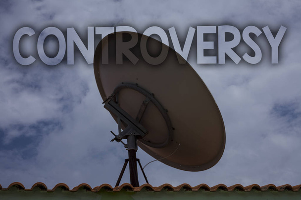 Conceptual hand writing showing Controversy. Business photo text Disagreement or Argument about something important to people Ideas messages television antenna cloudy sky old city house - Photo, Image