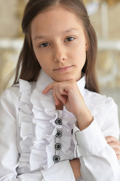 Emotional little girl in white blouse posing at home  - Fotografie, Obrázek