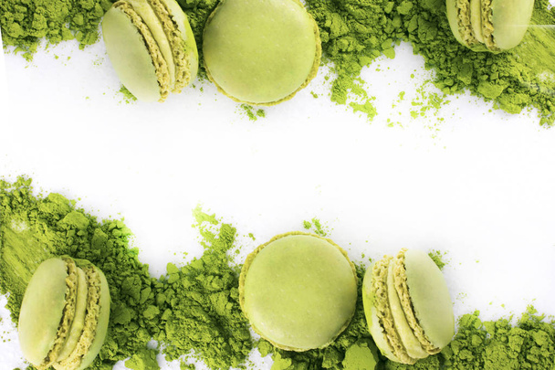 Macaroons with green tea powder matcha on white background. Asian taste - Photo, Image