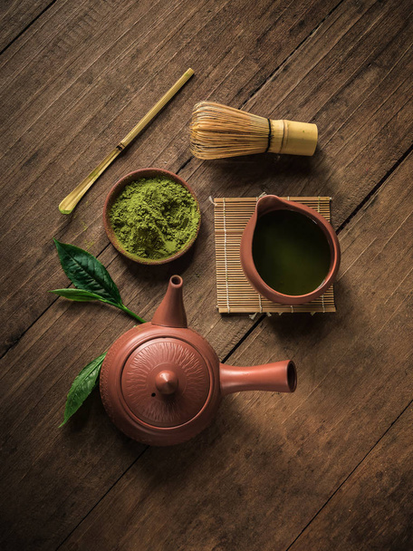 Top view of Japanese matcha accessories and green tea in bowl. - Foto, immagini