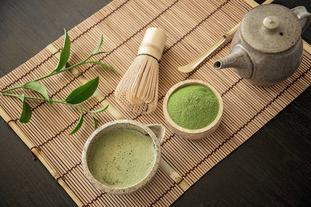 Top view of Organic Green Matcha Tea on bamboo napkin. - Фото, изображение