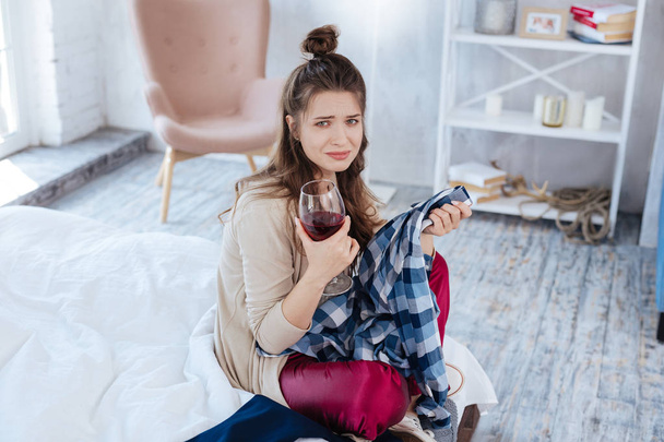 Young woman drinking wine after divorce case in court - Foto, immagini