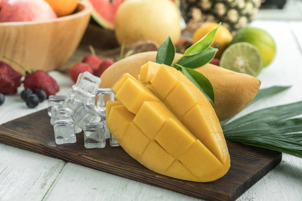 Close-up of Alphonso mango slices over wood background - Photo, Image