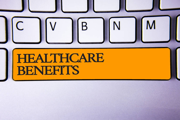 Writing note showing  Healthcare Benefits. Business photo showcasing it is insurance that covers the medical expenses Keyboard key Intention create computer message keypad idea notebook - Photo, Image