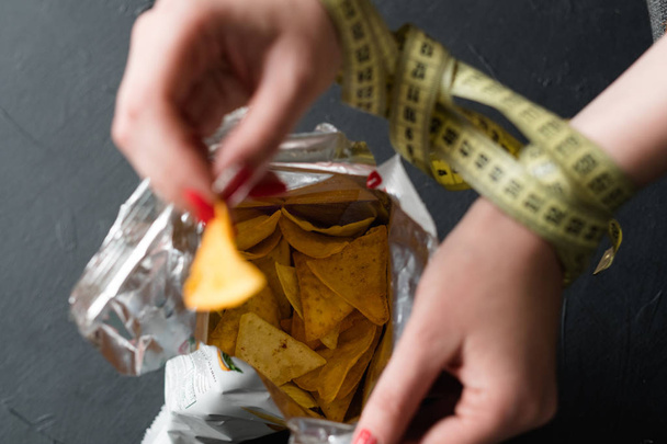 diet eating fast food forbidden chips woman hands - Photo, image