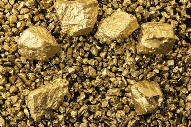 Rich background full of gold chunks and pieces - 写真・画像