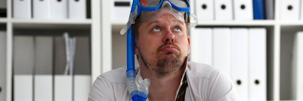 Man wearing suit and tie in goggles with snorkel - Photo, Image