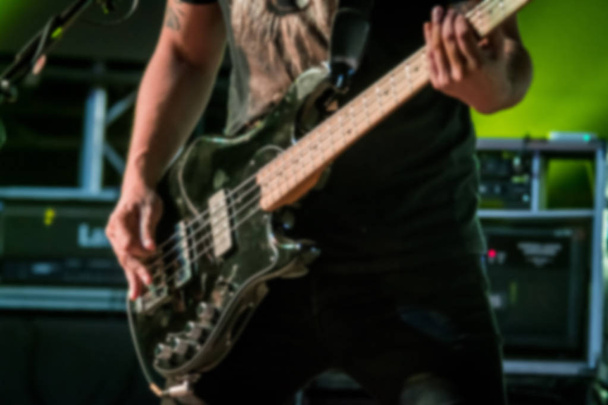 Blurred guitarist on stage background - Photo, Image